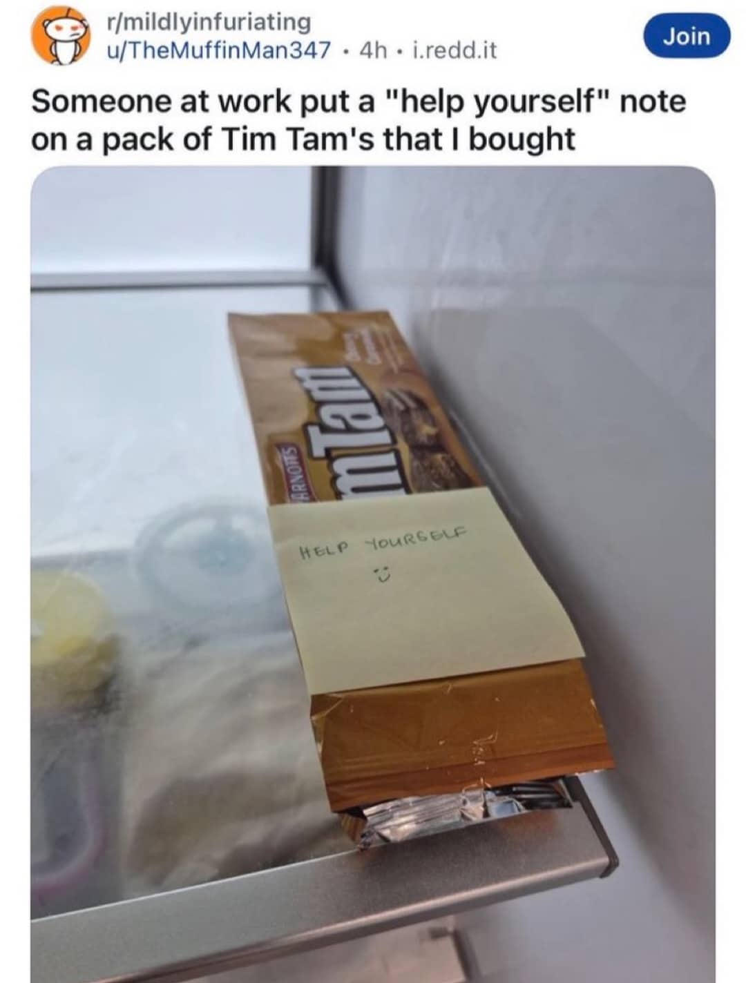 Pack of Tim Tam biscuits in a fridge with a sticky note saying help yourself.