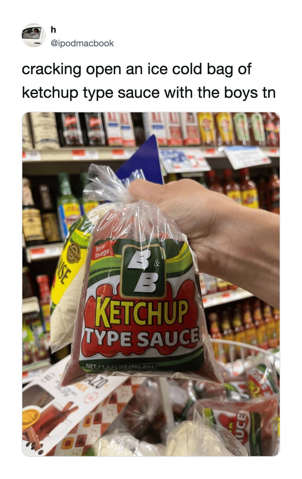 Hand holding a clear plastic bag labeled B and B Ketchup Type Sauce in supermarket.