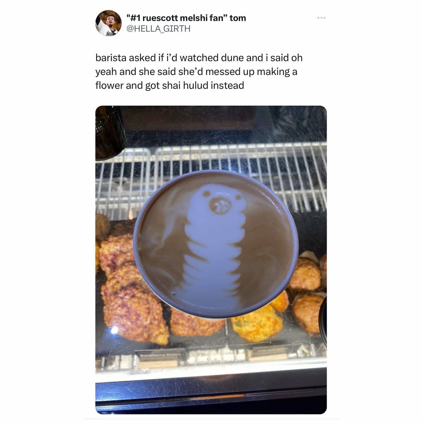 Latte art gone wrong in a coffee cup resembling a Shai Hulud sandworm from Dune.