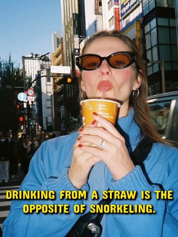 A woman drinking from a straw outdoors in a philosophical shower thoughts meme.