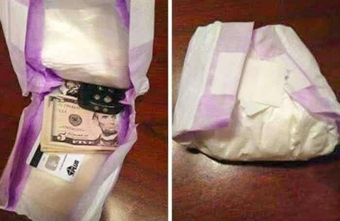 Cash and cards hidden inside a folded, clean baby diaper.
