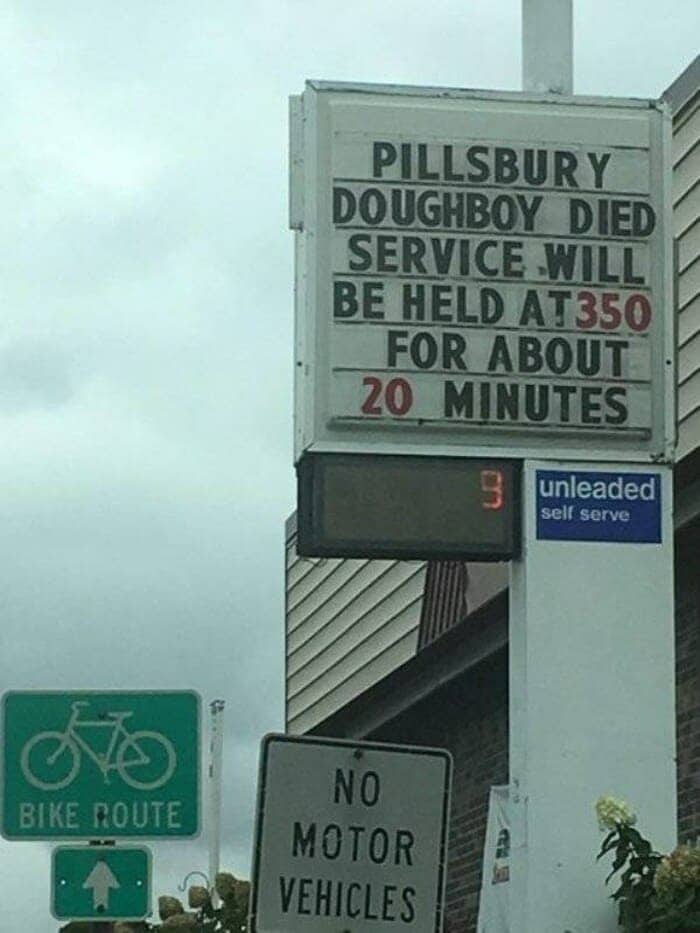 Roadside business sign announcing the funeral service of the Pillsbury Doughboy.