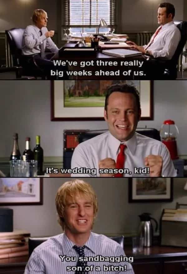 Vince Vaughn excited at his desk talking to Owen Wilson about wedding season meme.