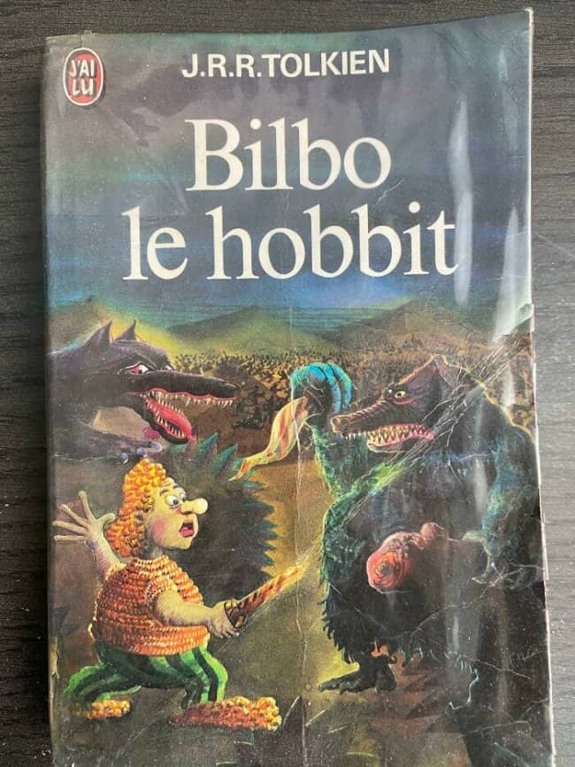 Vintage French edition of The Hobbit featuring bizarre, colorful fantasy creature illustrations.