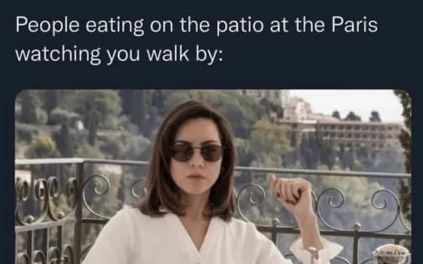 Funny meme of Aubrey Plaza wearing sunglasses with a judging expression on a balcony.