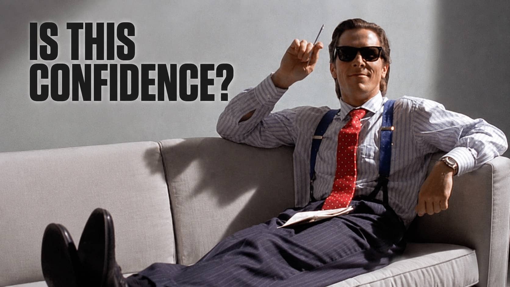 Patrick Bateman in suit and sunglasses lying on couch, confidence hacks meme.