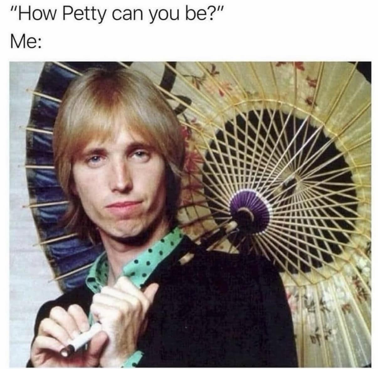 Image macro pun asking "How Petty can you be?" above a vintage photo of musician Tom Petty holding a parasol in a classic meme.