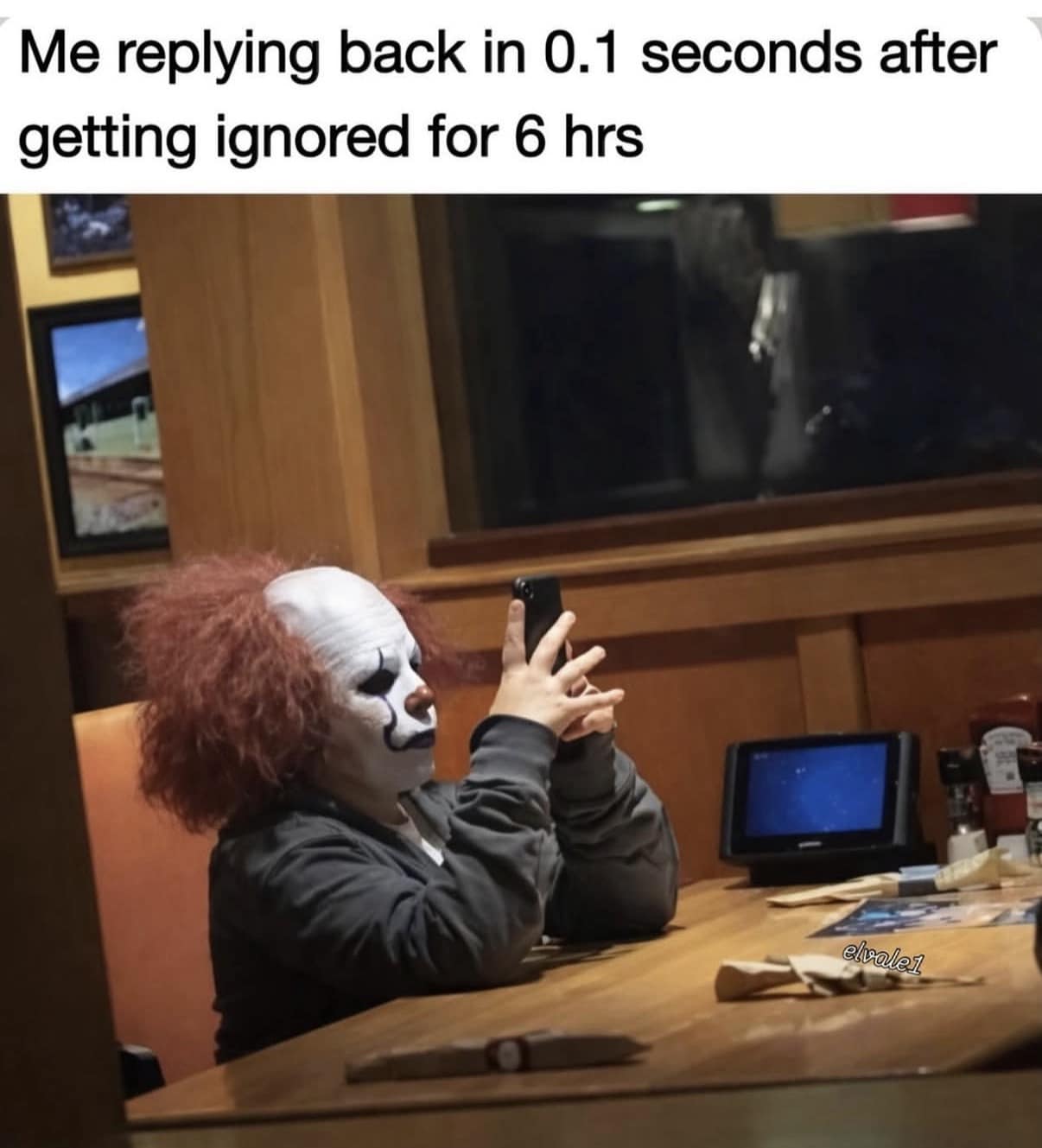 Person wearing a scary clown mask typing on a smartphone, representing instant text replies after being ignored for hours in a classic meme.