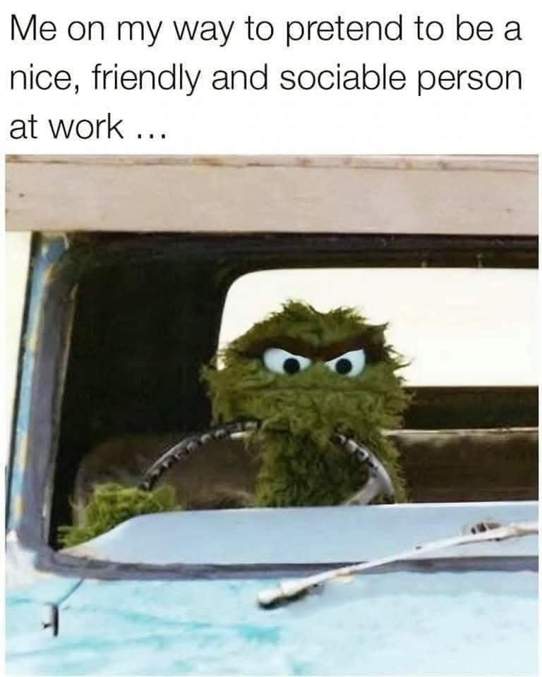 An iconic grumpy commute classic meme depicting Oscar the Grouch driving a rusted pickup truck under text describing traveling to work while mentally preparing to pretend to be friendly and social.