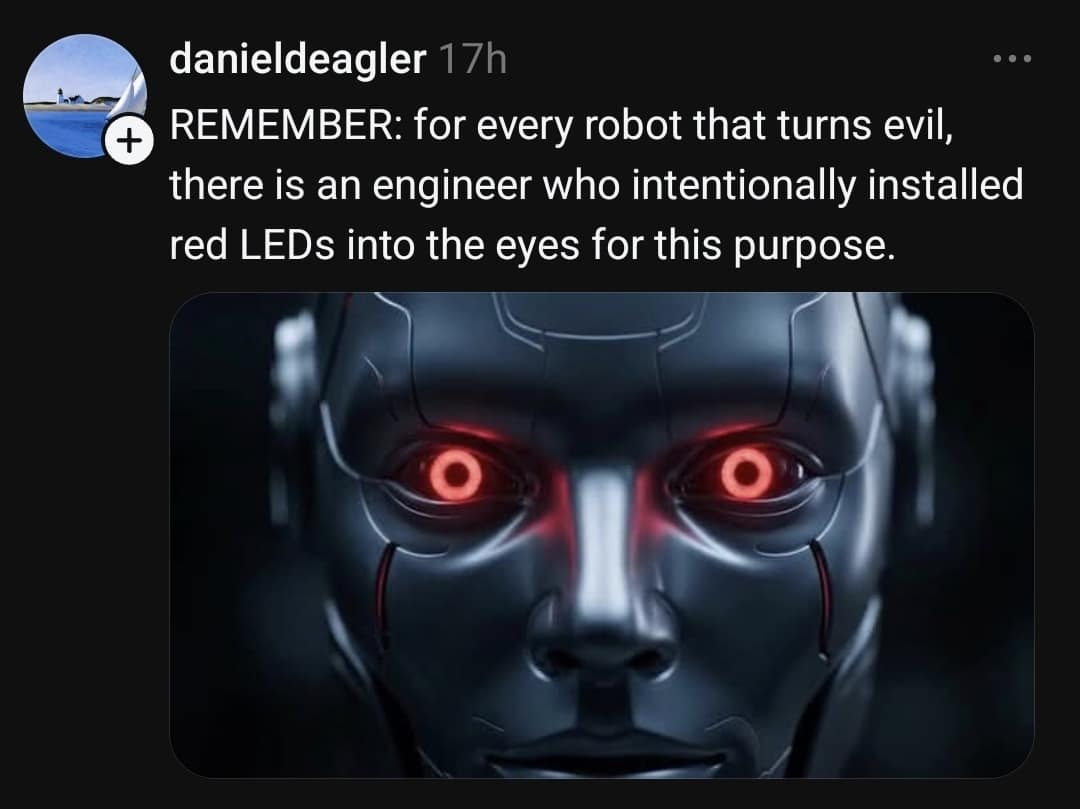 An evil robot design observation classic meme post featuring a dark android face with glowing red eye rings, pointing out the engineers who intentionally built red LEDs into them.