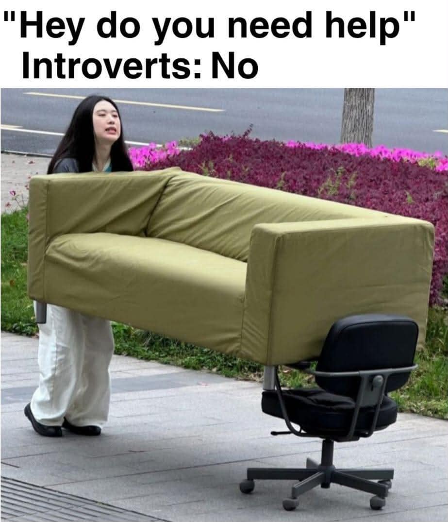 Introvert moving logic classic meme depicting a woman single-handedly pushing an entire green sofa down a sidewalk by balancing one end on a rolling office chair to avoid asking for help.