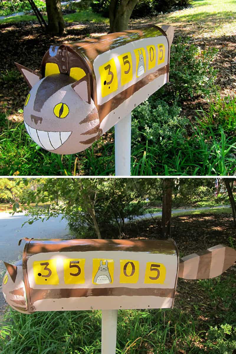 Studio Ghibli Catbus custom mailbox painted brown with smiling face, Totoro detail, and striped tail.