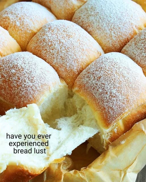 Food humor photo showing fresh soft bread rolls pulling apart with text.
