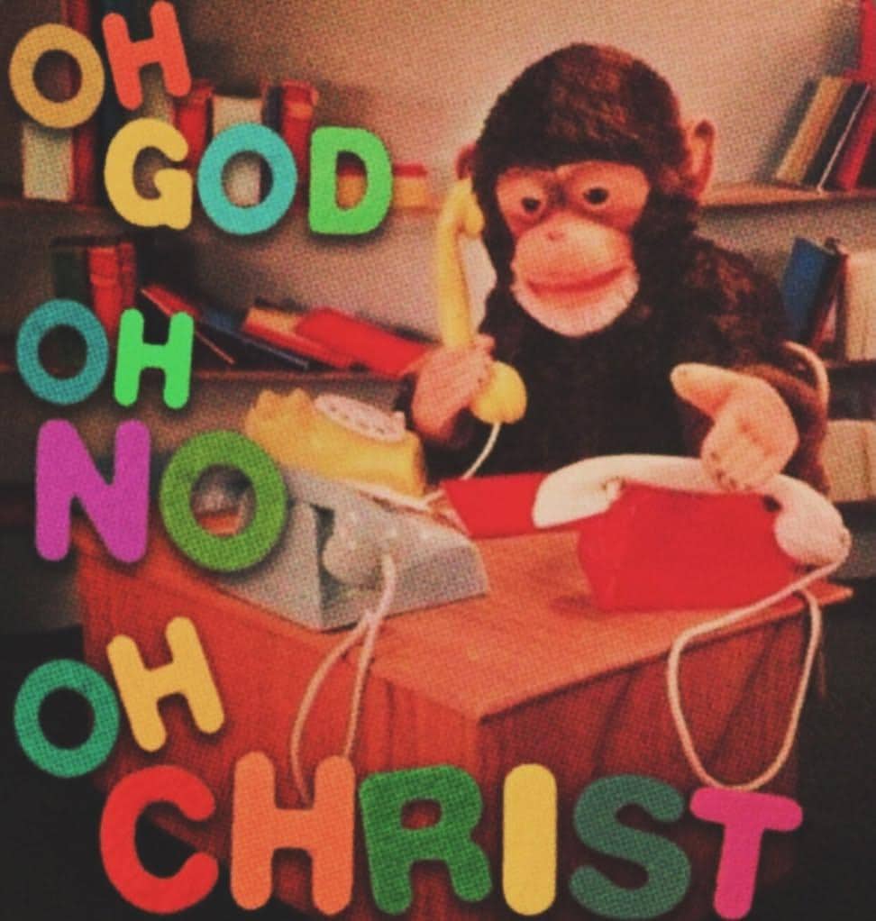 Stressed monkey holding a yellow telephone surrounded by letters spelling out oh god meme.