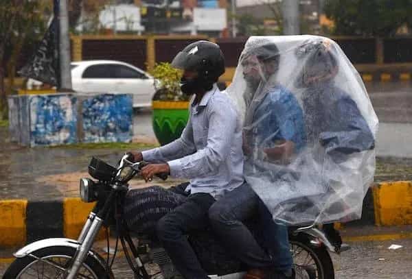 Two men riding motorcycle together under a large clear plastic rain cover funny memes.
