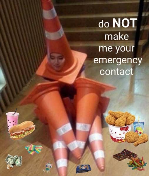 Person wearing multiple traffic cones on head and limbs surrounded by snacks funny meme.