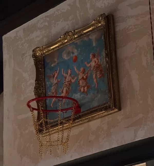 Renaissance art painting framed next to a basketball hoop like angels playing basketball.