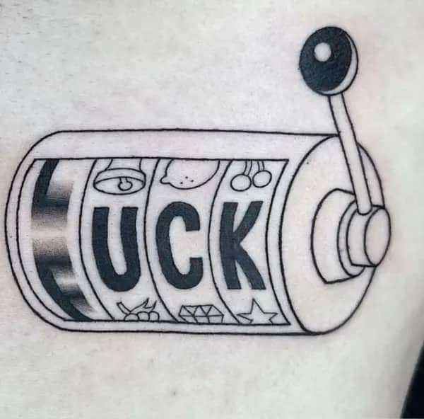 Slot machine tattoo featuring spinning reels spelling out luck with optical illusion funny meme.