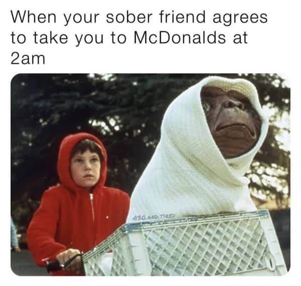 E.T. wrapped in a blanket in a bicycle basket driven by Elliott meme.