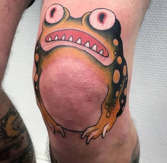 Colorful frog face tattooed on a kneecap showcasing creative placement among funny tattoos.
