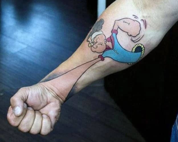 Popeye cartoon character tattooed on a forearm utilizing the actual fist for funny tattoos.