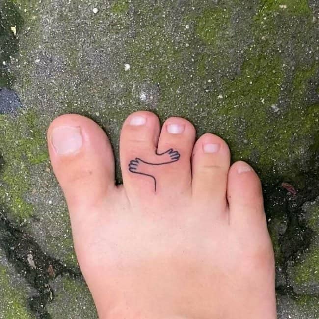 Minimalist line art toe tattoo of arms reaching out for a hug funny tattoos.