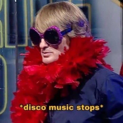 A party buzzkill reaction hangover meme featuring Owen Wilson as Hansel in Zoolander wearing a red feather boa and sunglasses, subtitled "disco music stops."