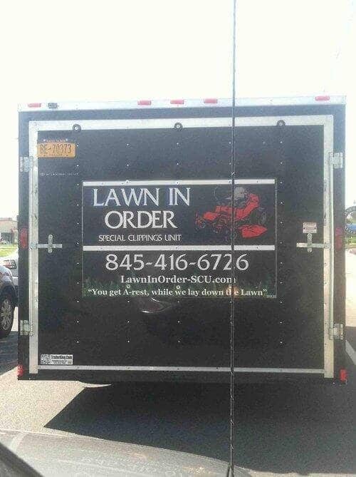 Enclosed utility trailer with Lawn In Order Special Clippings Unit funny business logo for lawn meme.