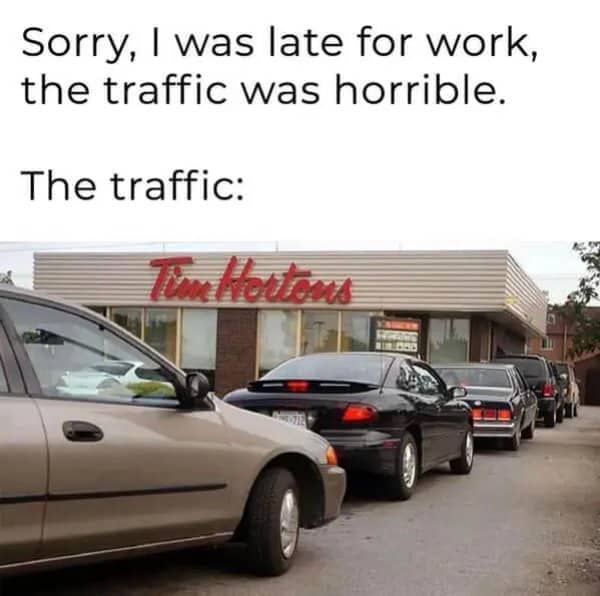 Relatable meanwhile in Canada meme showing a massive traffic jam at a Tim Hortons drive-thru.