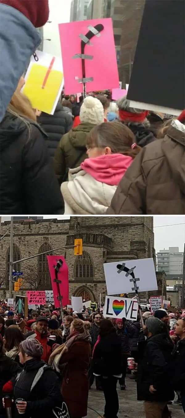 Meanwhile in Canada protest rally where demonstrators creatively use taped hockey sticks to hold signs.