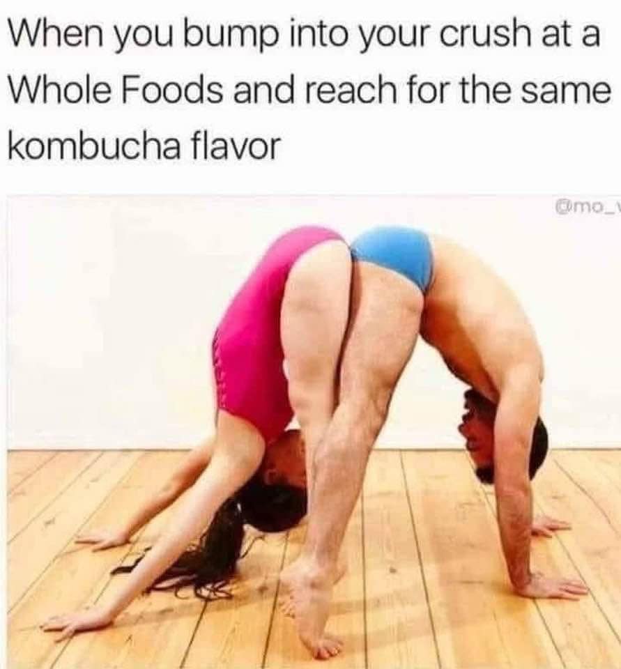 An awkward physical flexibility meme dump photo showing two gymnasts bent backward toward each other under text about bumping into a crush at Whole Foods reaching for kombucha.