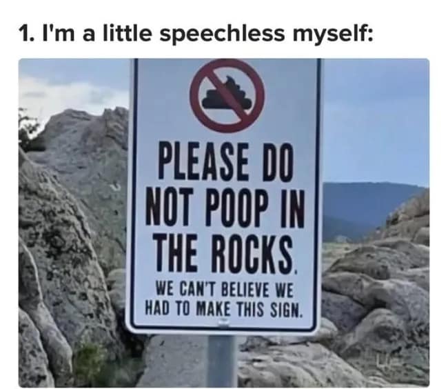 Official metal trail sign in a rocky park reading "PLEASE DO NOT POOP IN THE ROCKS. WE CAN'T BELIEVE WE HAD TO MAKE THIS SIGN."