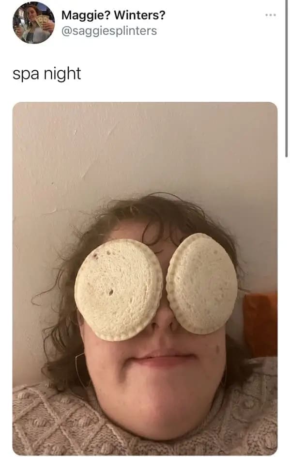 A budget wellness post acting as a hilarious meme tweet by @saggiesplinters showing a girl relaxing during "spa night" with two Uncrustables PB&J sandwiches covering her eyes.