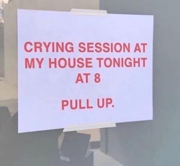 Printed white paper sign taped to glass featuring bold red capital letters announcing a "CRYING SESSION AT MY HOUSE TONIGHT AT 8 PULL UP."