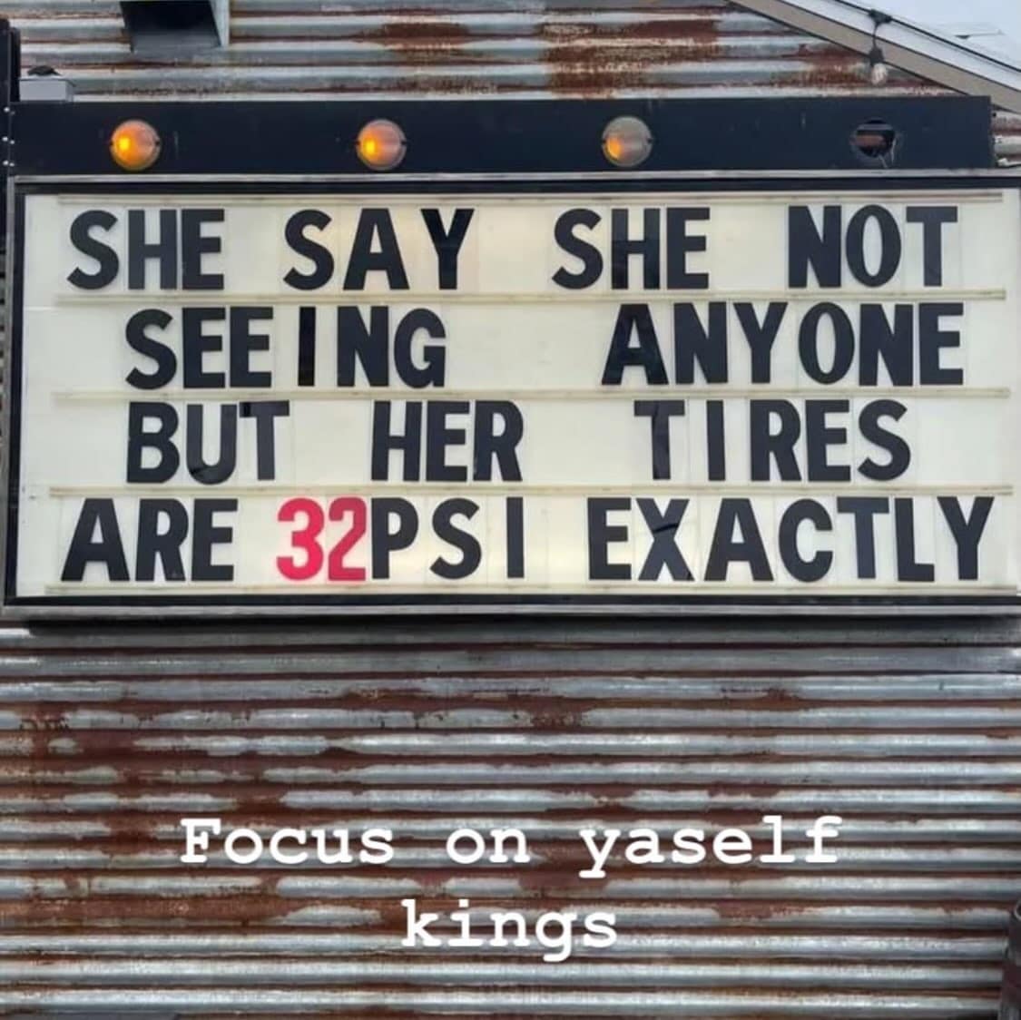 Gas station marquee sign delivering relationship advice by pointing out that perfectly inflated 32 PSI car tires indicate someone else is maintaining her vehicle.
