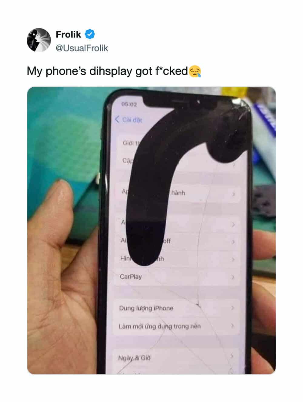Smartphone screen displaying settings menu obscured by a massive, dark ink-like liquid crystal display leak bleeding down the glass, featured in a meme dump.