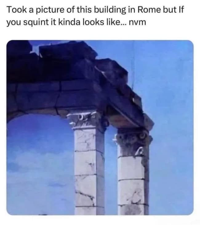 An architectural optical illusion photo featured as a hilarious meme showing ancient stone columns in Rome that create a hidden pareidolia image when squinting.