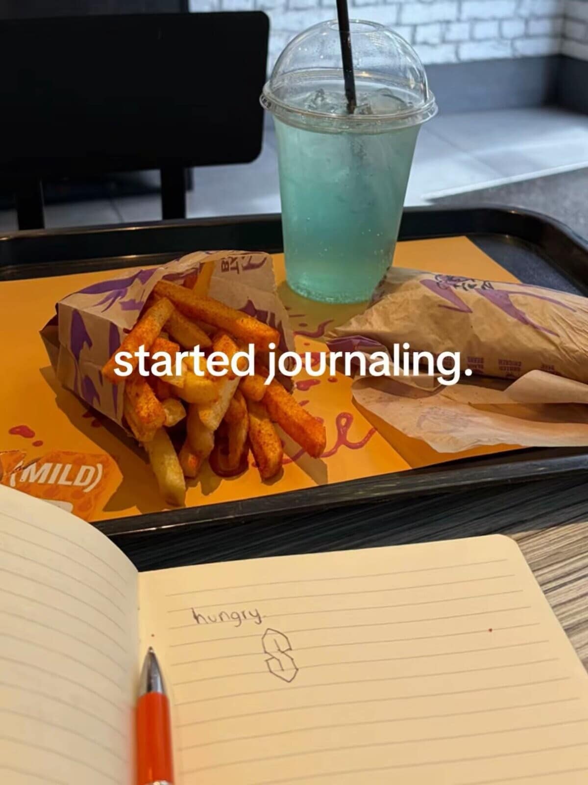 A relatable Taco Bell journaling photo featured in this meme dump showing a tray of fast food next to a notebook containing only the word "hungry" and a drawn Cool S.