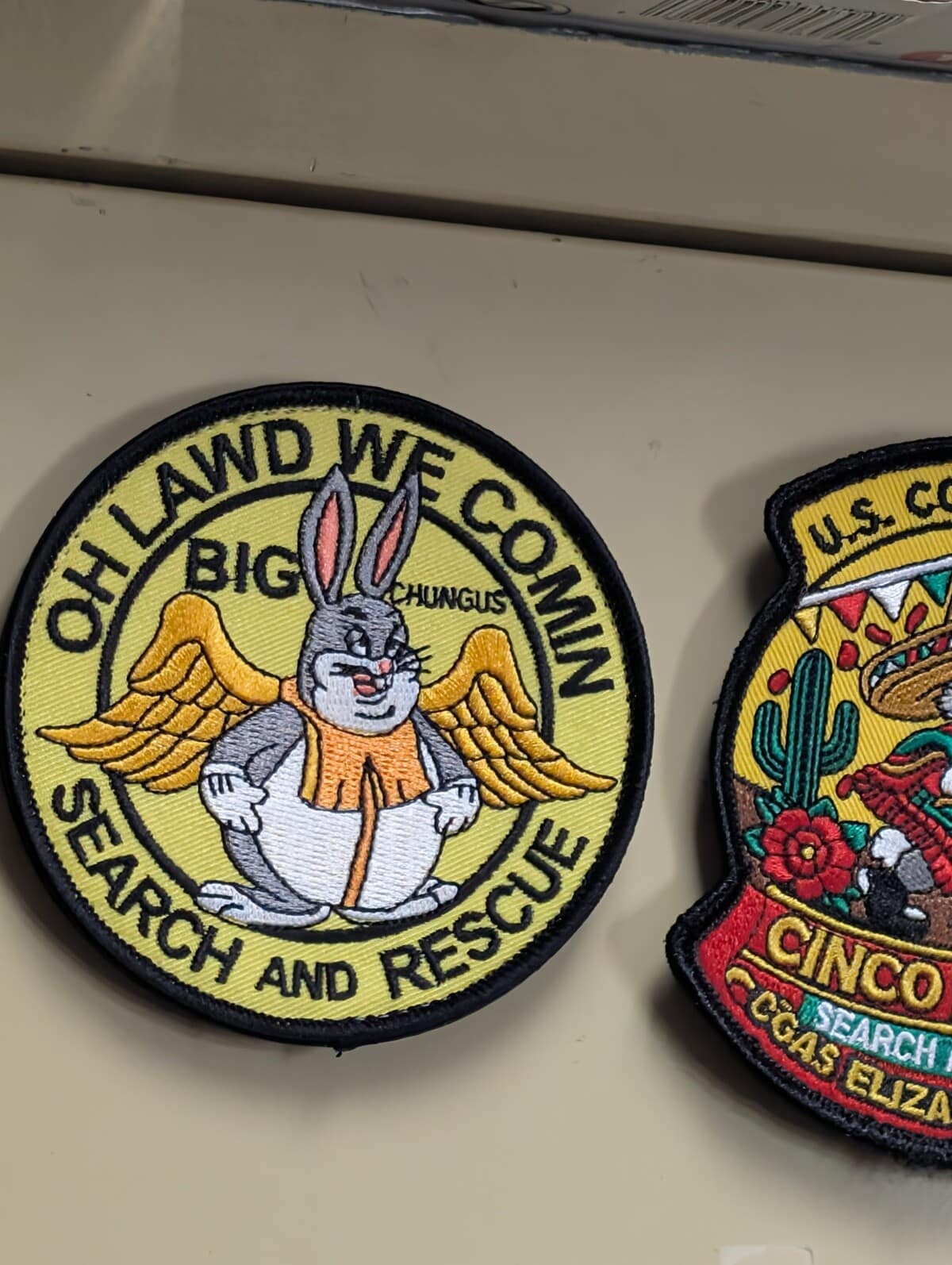 An absurd military-style embroidered patch in this meme dump featuring Big Chungus with angel wings labeled "Oh Lawd We Comin - Search and Rescue."