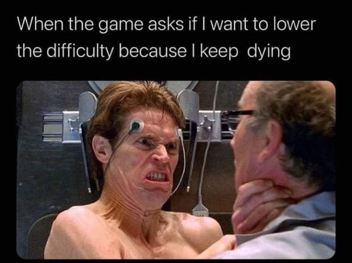 A gaming rage reaction photo in this meme dump using Willem Dafoe's aggressive face from Spider-Man for when a video game offers to lower difficulty after multiple deaths.