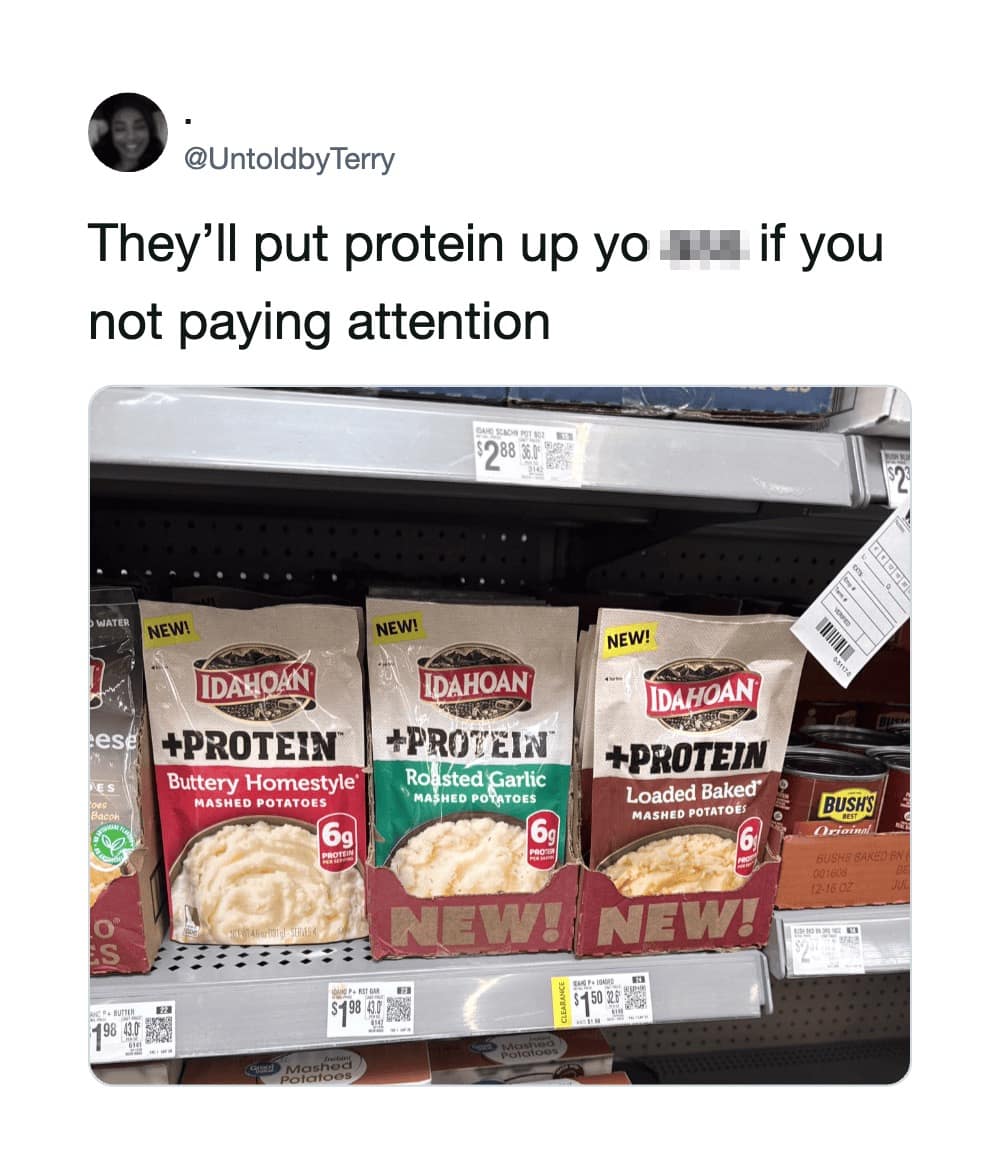 Alt Text: Supermarket shelf filled with packages of Idahoan instant mashed potatoes fortified with extra protein, paired with a commentary tweet in a funny meme.