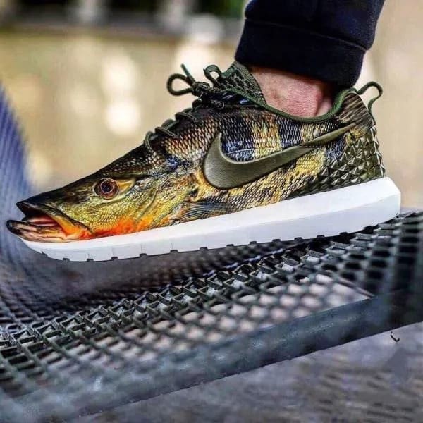 An athletic sneaker customized to look like a detailed largemouth bass fish funny memes.