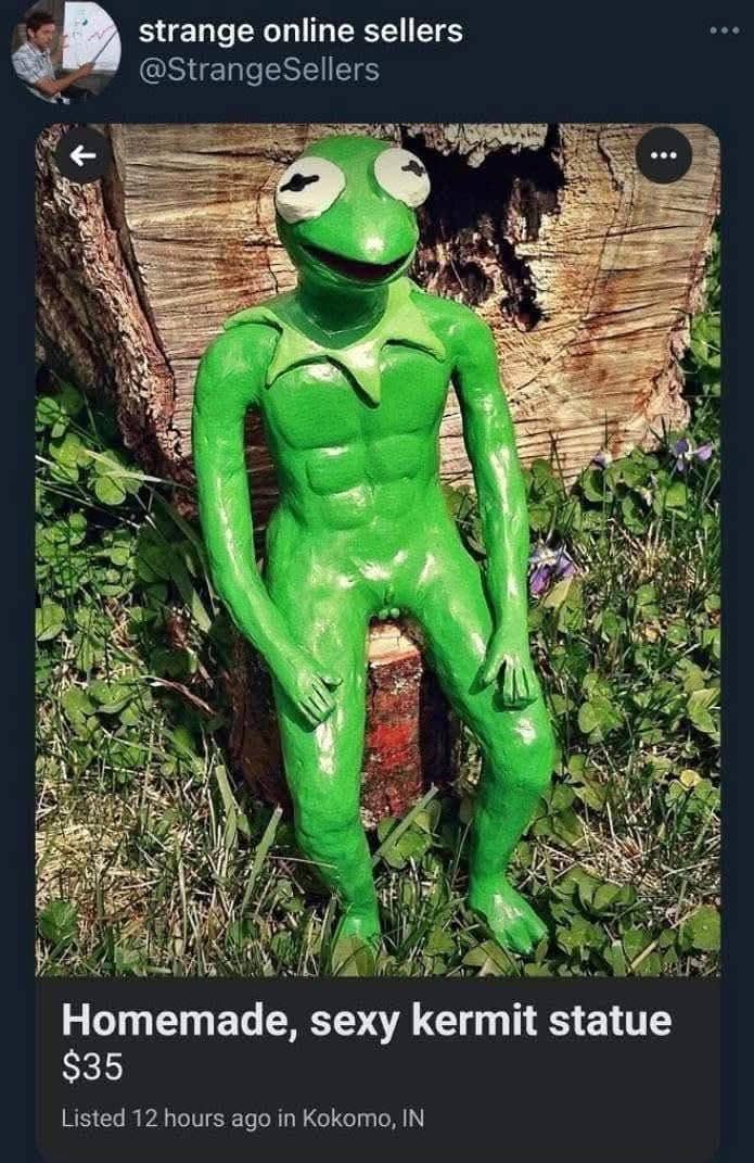 Muscular green Kermit the Frog statue seated on a wooden log in a garden, funny memes.