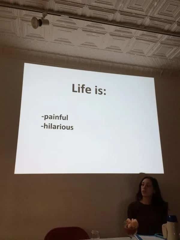 Presentation slide displaying a bulleted list stating life is both painful and hilarious for audience members.