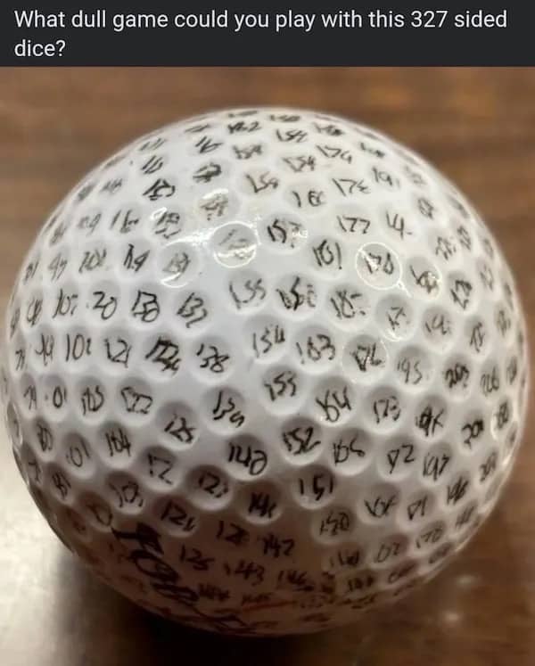 Golf ball with numbers written in every dimple labeled 327 sided dice funny meme.