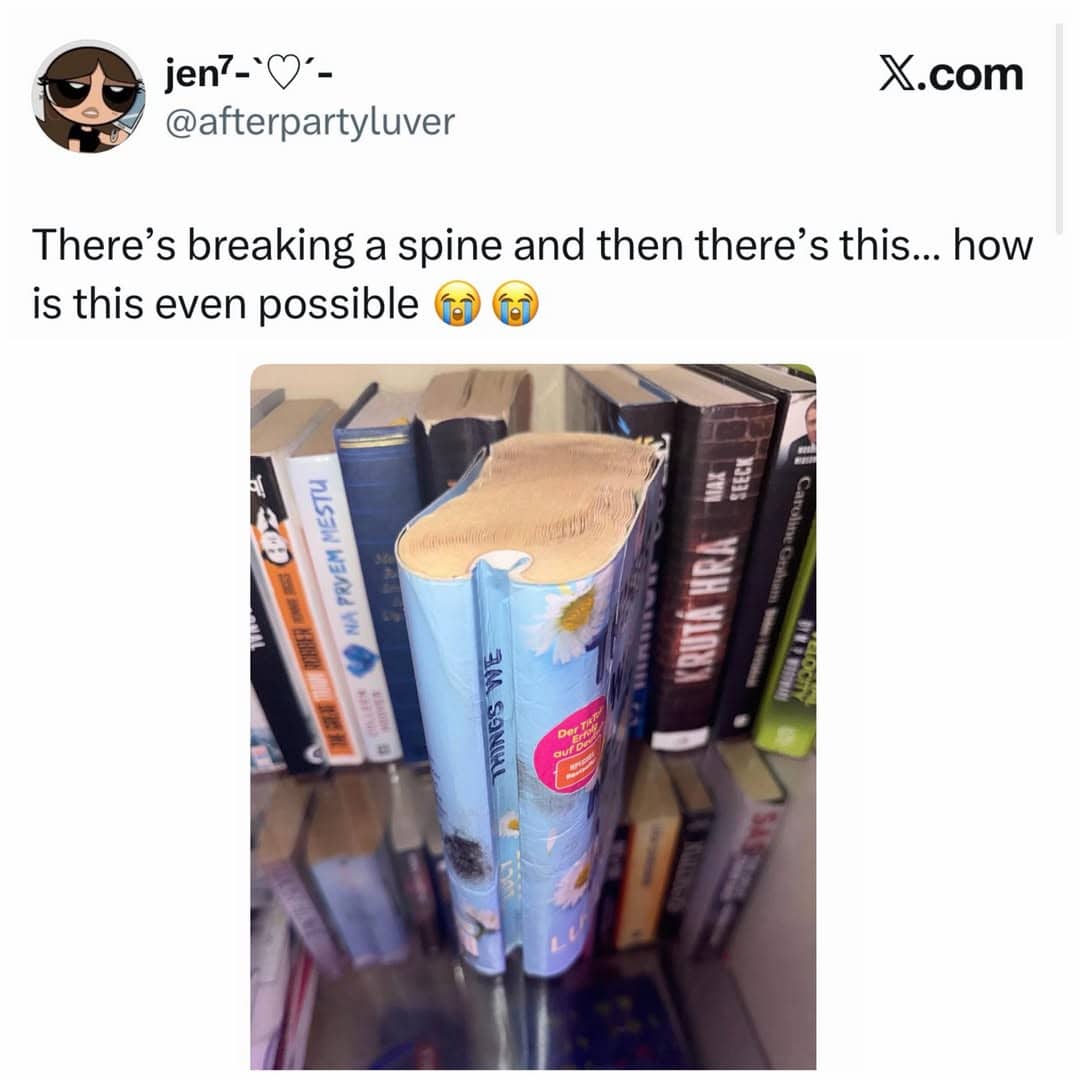 Paperback book with a severely warped and bent spine standing on a bookshelf.