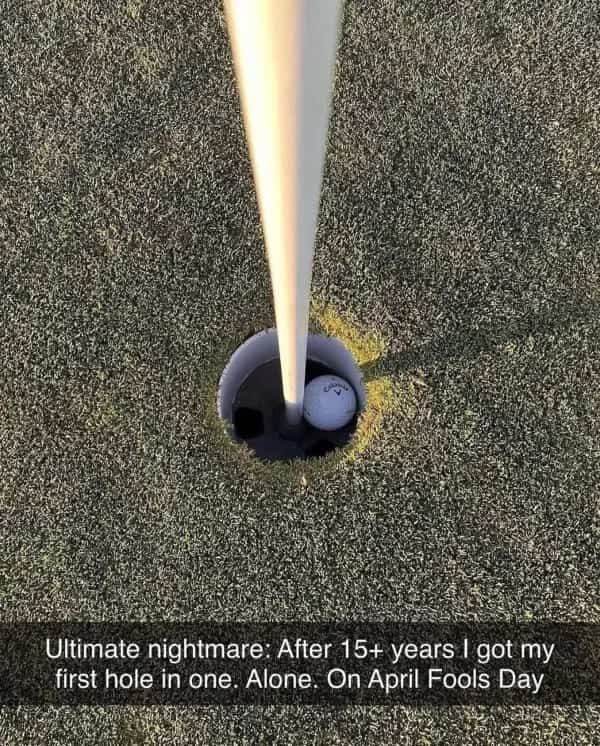 Golf ball inside the cup with text about getting a hole in one alone on April Fools.