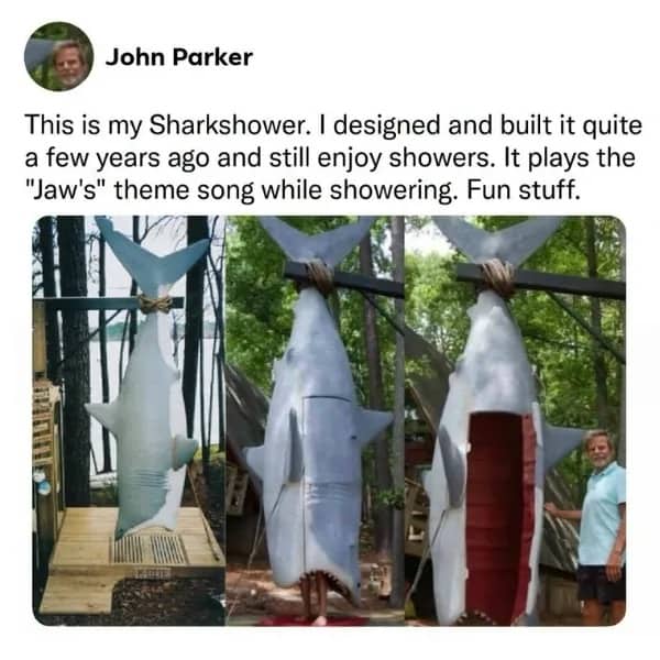 Custom outdoor shower built inside a hanging giant shark sculpture inspired by Jaws.