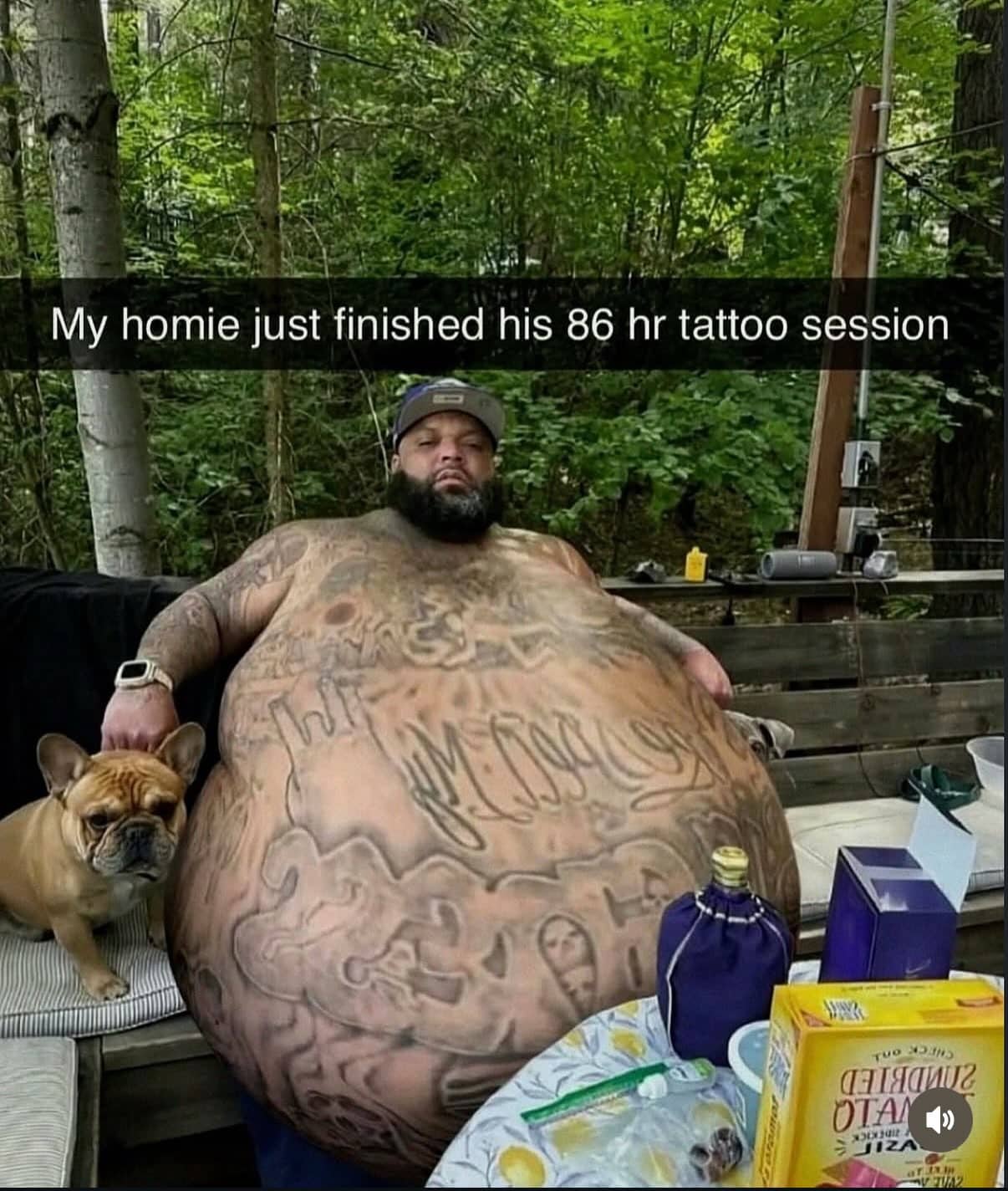 Man showing off massive torso chest tattoos sitting outdoors with small dog meme.