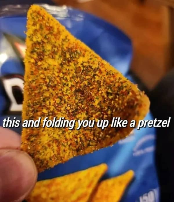 Hand holding a heavily seasoned tortilla chip with text about folding someone like a pretzel, funny memes.
